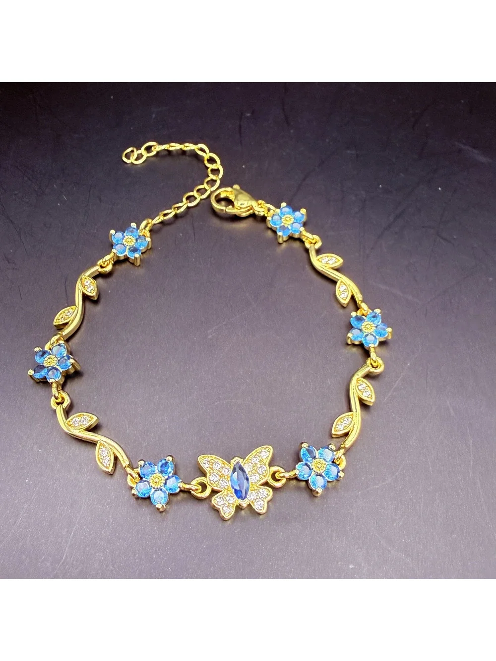 candy+clover Blue Crystal Flowers & Butterfly Gold Tone Bracelet